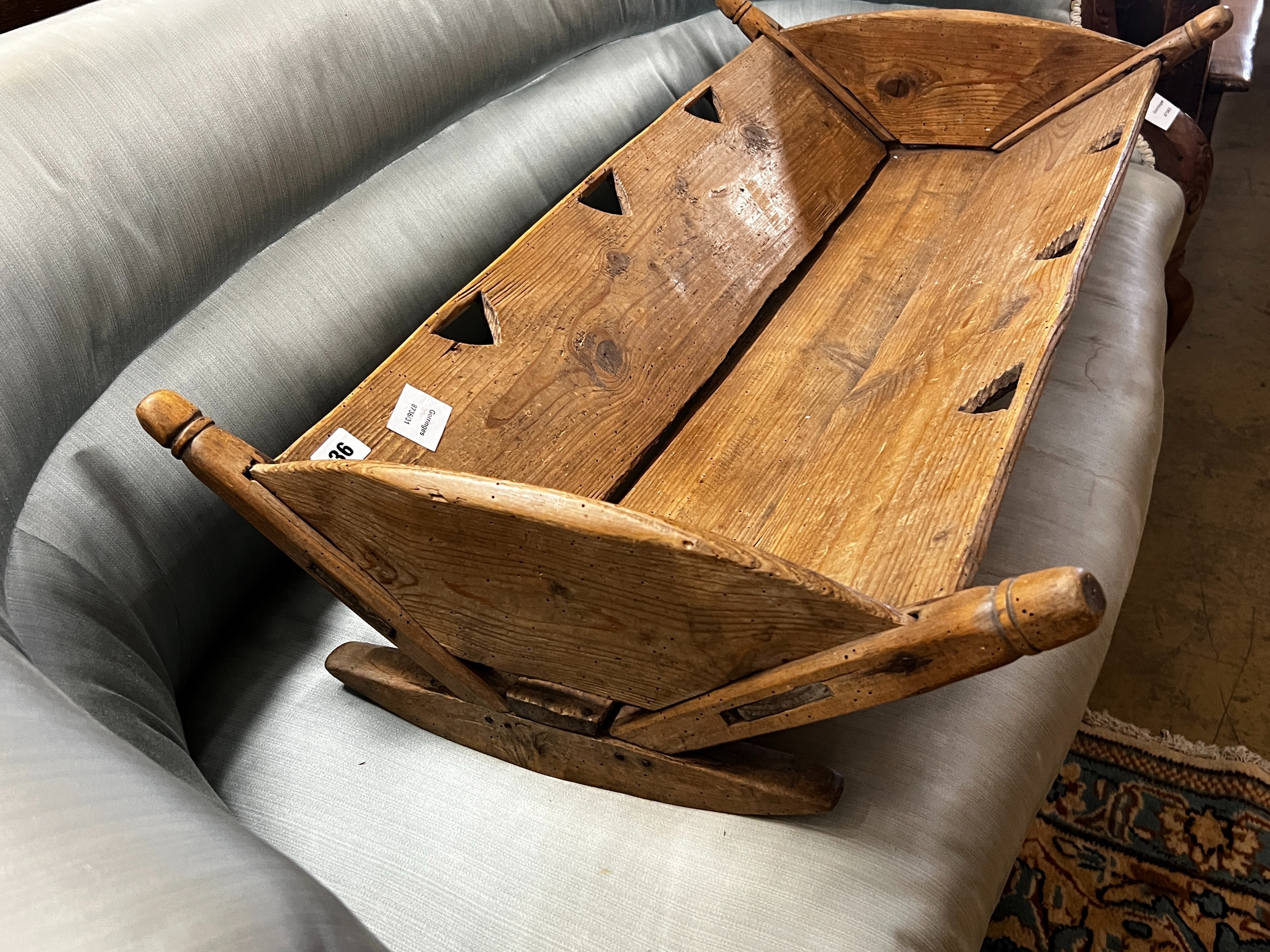 A 19th century French pine rocking crib, length 87cm, depth 48cm, height 18cm